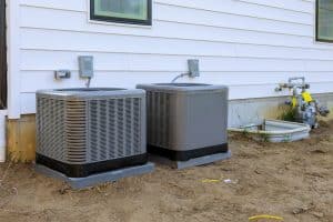 Air conditioning system unit installed outside facade of the new house